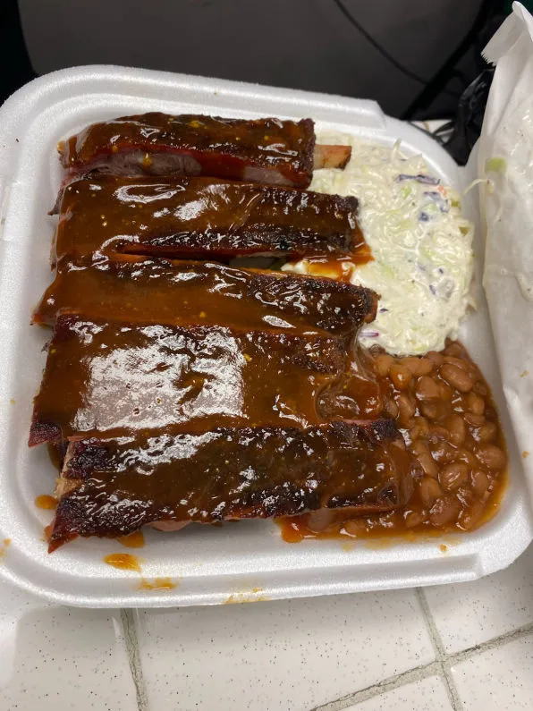 A slow-smoked rib plate with coleslaw and baked beans at Chatt Smokehouse in Chattanooga, TN